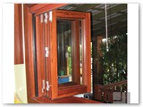 Bifold-servery-windows-with-timber-benchtop-using-surian-cedar-timber